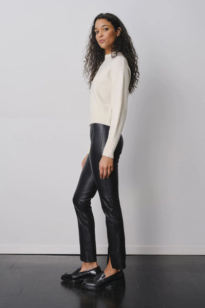 Black shops and white leather pants